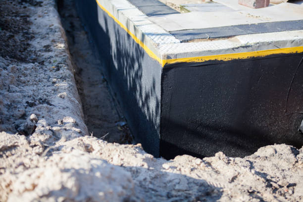 Professional Waterproofing technician working in Bellmawr, NJ
